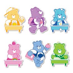 four different colored teddy bears sitting on a bench