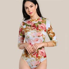 This lovely floral bodysuit is perfection! Featuring long sleeves and an o-neck; this bodysuit pairs perfectly with pants, jeans, shorts, skirts and leggings. Made with a polyester and spandex blend for comfort and style, while hugging your curves. Neck Flower, Casual Bodysuit, Floral Bodysuit, Floral Fit, Bodysuit Fashion, Krabi, Print Bodysuit, Flower Print, Mock Neck