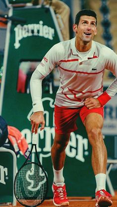 a man holding a tennis racquet on top of a tennis court