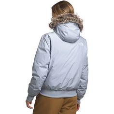 When falling leaves switch to snowy flurries, zip into The North Face's Arctic Bomber Jacket. This insulated layer provides the warmth we need as the seasons switch, and it features waterproof tech for added protection when snowstorms take us by surprise. Ribbed details give this jacket pilot-inspired flair, and a faux-fur ruff on the hood holds warmth close to the face while we explore. The North Face Winter Outerwear With Detachable Hood, Hooded Outerwear For Cold Weather Ski Season, Hooded Down Outerwear For Skiing, Insulated Outerwear For Ski Season, Weatherproof Skiing Outerwear For Fall, Outerwear With Detachable Hood For Ski Season, Winter Skiing Outerwear With Fleece Lining, Waterproof Outerwear For Cold Weather And Ski Season, The North Face Windproof Outerwear For Winter Sports