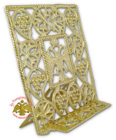 an ornate gold metal book holder