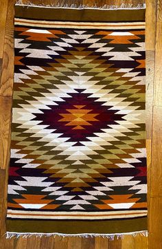 Handcrafted woven accent rug in bold earth tones. Easy to use with many color schemes. In very nice vintage condition. No flaws noticed. Sold as found at local estate sale. No stains, flaws, odors noticed. Small size would make it easy to use any way you want. Wall hanging, rug, accent cover for table, sofa, chair etc.  There is no label so I'm not sure if fabric content. It seems to be wool on a cotton warp. Please ask if you have any questions! Native Patterns, Hanging Rug, Table Sofa, Chevron Design, Accent Rug, Accent Rugs, Sofa Chair, Earth Tones