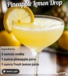 the pineapple lemon drop cocktail is served in a coupe glass, garnished with a slice of lemon