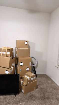 several boxes stacked on top of each other in a room