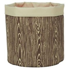 a brown and white potted planter with woodgrain pattern on it's sides