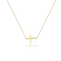 The dainty cross pendant necklace is a timeless classic that every woman needs in her jewelry collection. This necklace is the perfect accessory for any outfit, adding a touch of elegance and sophistication. The adjustable length allows for a personalized fit, ensuring comfort throughout the day. Crafted from high-qual Classic Cross Clavicle Chain Necklace, Classic Clavicle Chain Necklace With Cross Pendant, Classic Cross Pendant Clavicle Necklace, Simple Yellow Gold Cross Necklace, Elegant Cross Necklace With Adjustable Chain, Minimalist Crucifix Necklace With Adjustable Chain, Everyday Cross Necklace With Clavicle Chain, Simple Necklace With Delicate Chain And Cross Pendant, Minimalist Clavicle Chain Necklace With Cross Pendant