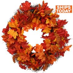 a wreath with orange and red leaves on it, isolated against a white background photo