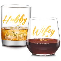 two glasses filled with different types of alcohol and one has the word hubby on it