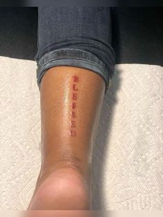 a woman's leg with the word love written on it