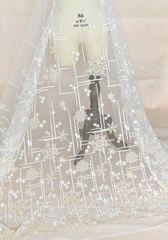 "Champagne Snowflaker Ivory Tulle Lace Fabric Embroidered Tulle Lace Veil Gauze wedding Dress Garment accessories 51\" wide 1 yard S0865 ♥This listing is for 1 yard fabric. if you order more, will send them in one continous piece. ♥Width: 1.3meters, in inch:51\" ♥Wholesale acceptable! ♥If you want more, please feel free to send me a message. I will be glad to make custom listing for you! ♥Happy shopping here" White Organza Embroidered Fabric For Ceremony, Festive White Embroidered Lace, Embroidered White Organza Tulle Fabric, White Embroidered Organza Tulle Fabric, White Embroidered Fabric With Sheer Dupatta For Party, White Embroidered Tulle Organza Fabric, White Lace Embroidered Fabric For Festive Occasion, Festive White Lace Embroidered Fabric, White Organza Tulle Fabric With Intricate Embroidery