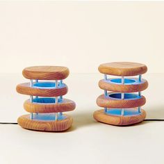 three stacked wooden objects sitting on top of each other