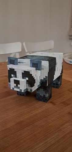 a panda bear made out of lego blocks on a table