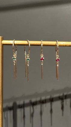 From designer Jack & G, the classic chime earring set with an emerald or pink sapphire. -sold as a single earring -14k yellow gold 14k Gold Dangle Jewelry For May Birthstone, Fine Jewelry Yellow Gold Birthstone Earrings, Yellow Gold Dangle Hoop Earrings With Gemstones, 14k Gold Gemstone Drop Earrings, Dainty 14k Gold Gemstone Earrings, Minimalist 14k Gold May Birthstone Earrings, 14k White Gold Earrings With Gemstone, White Gold 14k Gemstone Earrings, Fine Jewelry Gold-plated Birthstone Earrings