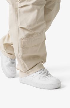 The ultrabaggy fit of these nonstretch cotton pants lets you move with ease all day long, while the cargo pockets keep all your essentials close at hand. 32 1/2" inseam; 9 1/2" leg opening Zip fly with button closure Front scoop pockets; cargo flap-patch pockets; back patch pockets 100% cotton Machine wash, tumble dry Imported Cargo Pants Outfit Men, Pants Outfit Men, Cotton Cargo Pants, Baggy Cargo Pants, Cargo Pants Outfit, Ripstop Fabric, Cotton Pants, Baggy Fits, Cargo Pants