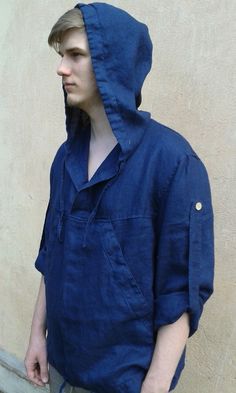 "Voluminous blouson \"Vento\" with a hood. Patch pocket like kangaroo's. Long stitched-in sleeve, a little lowered shoulder. Hood and bottom of the garment are regulated by the slide. The model is wearing size L and is 5 feet 10.87 inches or 180 cm tall. Each piece is individually cut, sewn and pre-washed. We really love making tops for various sizes - from petit to plus size and more. For the best fitting of this shirt please let us know the following measurements: - your height - your bust cir Hooded Tops With Pockets For Outdoor Activities, Outdoor Hooded Tops With Pockets, Relaxed Fit Hoodie With Pockets For Outdoor, Hooded Outdoor Tops With Kangaroo Pocket, Hooded Tops With Kangaroo Pocket For Outdoor, Hooded Top With Kangaroo Pocket For Outdoor, Outdoor Hooded Top With Kangaroo Pocket, Casual Outdoor Tops With Kangaroo Pocket, Relaxed Fit Hooded Jacket For Outdoor