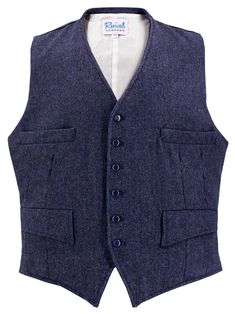 "Our new Granville waistcoat is inspired by original vintage 1930s - 1940s era waistcoats from our own archive collection. This classic cut of waistcoat is shorter in the body, to wear with high-waisted trousers. It's made of a navy blue herringbone wool weave, and features a six-button fastening, with navy blue mother-of-pearl effect buttons. A highly-requested Revival own-brand classic, this authentically styled men's vest is designed to be worn with a matching pair of our Granville notch-back trousers for a truly incredible 40s look. It can also be a versatile standalone piece in the wardrobe of a vintage enthusiast. The Granville waistcoat has a four-pocket design, with two working flap pockets at the waist and two further working welt pockets at the breast. Fully lined with a coordina Tailored Vintage Wool Vest, Classic Wool Vest With Button Closure, Classic Notch Lapel Vest For Winter, Classic Winter Vest For Semi-formal Occasions, Formal Winter Vest With Pockets, Tailored Vintage Winter Vest, Vintage Workwear Vest With Pockets, Vintage Vest With Pockets For Work, Vintage Wool Vest For Formal Occasions