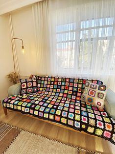 a living room with a couch covered in crochet