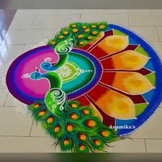 a colorful peacock design on the ground