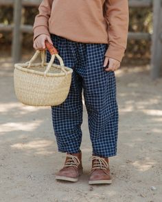 A simple unisex everyday woven pant with a bit of a rounded shape for comfort and slouch. Side seam pockets & elastic waist. New this season in a navy/ natural grid pattern.fit: true to sizecontent: hemp/ organic cottoncare: machine wash, cold waterMade in Los Angeles Eco Brand, Eco Friendly Kids, Stripe Pants, Culotte Pants, Maternity Swimwear, Grid Pattern, Kids Pants, Skirted Swimwear, Baby Clothing