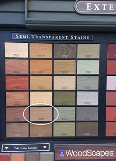 a display case with different types of wood samples on it's front wall and the words sem - transparentent stains above them