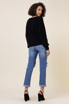 A pair of high-waisted boyfriend jeans featuring a distressed front, classic 5-pocket construction, zip-fly closure, and optional rolled cuff. Rise: 11.5", Inseam: 29" (unfold) Model is 5'8" and wearing a size 3