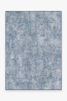 a blue rug with an abstract design on the top and bottom, it is very soft