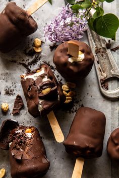 chocolate covered desserts are sitting on a table