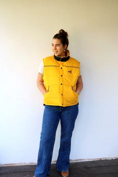 "Awesome vintage Kodak Film puffer vest in yellow and black Embroidered logo Kodak Film in black, snap button down, original tag intact - Eastman kodak company- made in U.S.A.  Unisex can be worn by both men and women. aside from minor signs of wear, good vintage condition, clean, ready to wear.  Approximate size: One size fits most- tag reads size XL- please refer to the measurements. M E A S U R E M E N T S -were taken with garments laying flat, please double where necessary. ----------------- Yellow Sleeveless Outerwear For Fall, Sleeveless Yellow Outerwear For Fall, Yellow Sleeveless Fall Outerwear, Vintage Vest Outerwear For Streetwear, Vintage Streetwear Outerwear Vest, Vintage Style Vest Outerwear For Streetwear, Vintage Winter Vest For Streetwear, Vintage Kodak, Yellow Logo