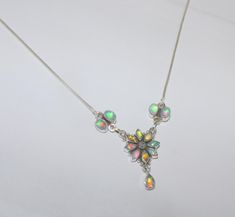 Natural Ethiopian fire opal necklace in 925 sterling silver ; opal Marquise size ; 3 x 6 mm opal oval size ; 3 x 6 mm  opal pear size ; 5 x 7 mm in this necklace chain is used high and heavy quality silver ; 100%  Natural Ethiopian opal / 925 sterling silver https://www.etsy.com/in-en/listing/811744928/natural-ethiopian-fire-opal-necklace?click_key=08d0fda04689340765f0ed6ca7ae1d3a26b839ac%3A811744928&click_sum=ca807e8a&ref=shop_home_active_6&frs=1 https://www.etsy.com/in-en/listing/1084513040/na Handmade Elegant Opal Necklace, Silver Opal Necklace Gift, Silver Opal Necklace For Gift, White Ethiopian Opal Gemstone Jewelry, Handmade Ethiopian Opal Elegant Necklace, Handmade White Opal Necklaces, Ethiopian Opal Pendant Necklace Gift, White Ethiopian Opal Gemstone Necklace, Handmade Silver Necklace With Ethiopian Opal