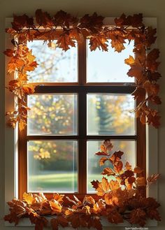 an open window with leaves on it