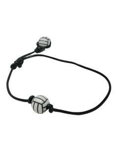 a black and white bracelet with two beads