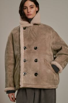 - Generous volume- Double-breasted opening- Two piped pockets- Suede lambskin shearling coat Beige Winter Coat, Brown Shearling Outerwear With Padded Collar, Luxury Beige Shearling Outerwear, Brown Shearling Fur Coat With Padded Collar, Designer Brown Sheepskin Outerwear, Luxury Brown Shearling Fur Coat, Accessories Bags Shoes, Brand Campaign, Shearling Coat