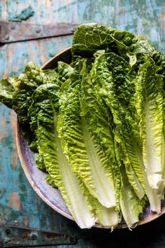 lettuce in a bowl on a wooden table