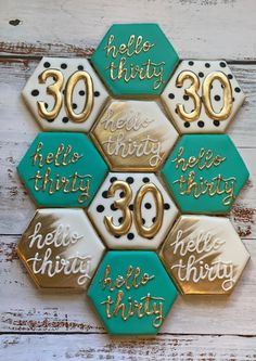 some cookies that are shaped like hexagons with the words hello thirty on them