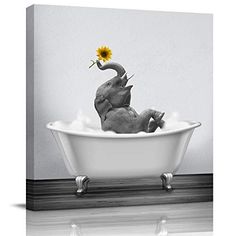 an elephant in a bathtub with a sunflower