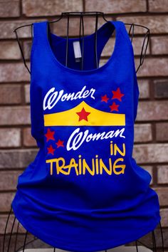 Wonder Woman in Training Workout Tank - Funny Tank Top Workout Cotton T-shirt With Screen Print, Pre-shrunk Cotton Sleeveless T-shirt, Blue Tank Top For Training, Blue Cotton Workout T-shirt, Stretch Cotton T-shirt With Moisture-wicking, Blue Cotton T-shirt For Workout, Comfortable Cotton Training T-shirt, Blue Cotton Training Tops, Blue Graphic Print T-shirt For Training