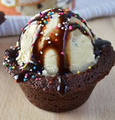 an ice cream sundae with chocolate and sprinkles