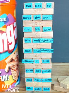 a stack of wooden blocks next to a can of gum