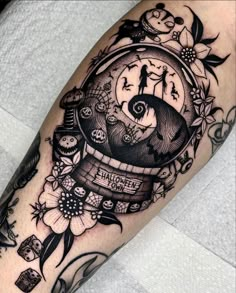 a black and white tattoo with an image of a clock in the middle of it