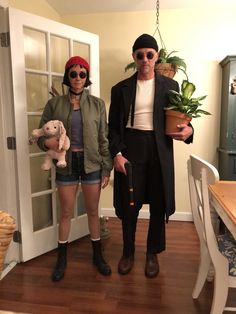 a man and woman dressed up in costumes