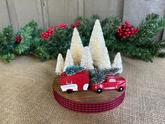 a red truck with christmas trees on it