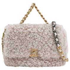 Chanel 19 Bag 2021 Small Pink Shearling Flap Bag These are professional photos of the actual bag offered by Luxbags. This 2021 Chanel 19 small pink shearling flap bag is your cutest winter accessory. Expertly crafted in Italy, featuring an interwoven CC-lock that adds a metallic touch to a fluffy pink shearling lambskin. With a sturdy gold chain handle and two-tone metal strap, this bag can be carried by hand or on the shoulder with ease. CONDITION: Excellent condition with light signs of use. Scratches on the hardware, very light scuffs around the corners, strap. Minimal stains on the inside. DETAILS: Model: Chanel 19 Bag Size: Small Dimensions: Width: 24cm; Height: 18cm; Depth: 8cm Weight: 960g Color: Pink Hardware color: Gold and gunmetal Material: Shearling Serial number: 30265148 ACCE Chanel 19 Small, Chanel 19 Bag, Chanel 19, Professional Photos, Pink Tweed, Metal Straps, Chanel Vintage, Bag Collection, Winter Accessories