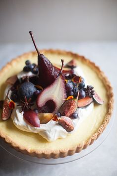 a pie with fruit and whipped cream on top