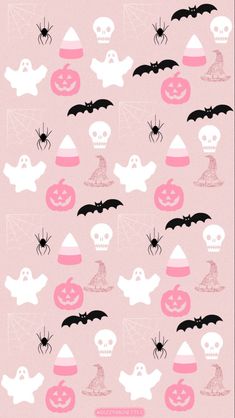 a pink background with white and black halloween decorations