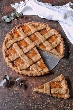 an apple pie with one slice cut out