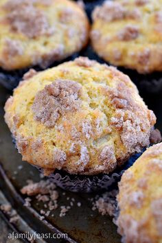 freshly baked muffins with powdered sugar on top