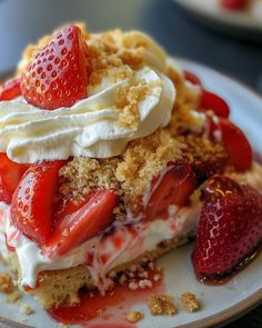 a dessert with strawberries and whipped cream on top