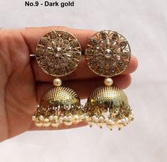 Dark Gold jhumka earrings tikka set. Earrings length: 2.8 inches (with drops) Stud diameter- 1.2 inches Dome Size: 1.1 inches Dual-tone Kundan Jhumkas For Wedding, Dual-tone Jhumkas For Wedding And Navratri, Dual-tone Danglers For Wedding And Navratri, Dual-tone Chandbali Jhumkas For Wedding, Dual-tone Chandbalis For Wedding And Navratri, Bollywood Style Dual-tone Chandbalis For Wedding, Dual-tone Kundan Jhumkas For Diwali, Dual-tone Jhumkas For Wedding Festivals, Bollywood Dual-tone Jhumkas For Diwali