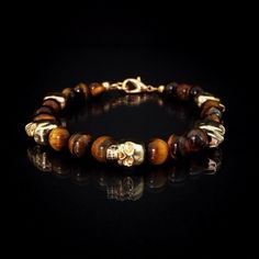 Gold Skull And Genuine Tiger’s Eye Men’s Beaded Bracelet Golden Brown Tiger’s Eye Gemstones Accent Gold Skulls In This Handmade Men’s Bracelet. Details: Bracelet Features 10mm Gold Plated Skulls And Individually Selected 8mm Genuine Tiger Eye Gemstones Strung On Stainless Steel. Comes With Lobster Clasp Closure. Measurements: 8 Inches In Length Including Clasp And 10mm At The Widest Point. (Also Available In 9” And 7”, Please Inquire.) Weight: 31g Condition: Handmade Adjustable Gold Skull Bracelets, Gold Adjustable Skull Bracelets, Brown Tiger, S Bracelet, Gold Skull, Tigers Eye Gemstone, Mens Accessories Jewelry, Golden Brown, Handmade Accessories