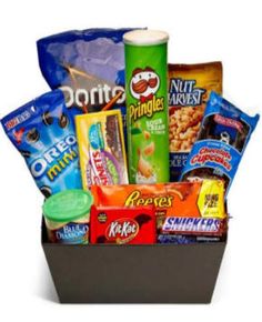 the snack box is filled with snacks, candy, and other things to eat in it